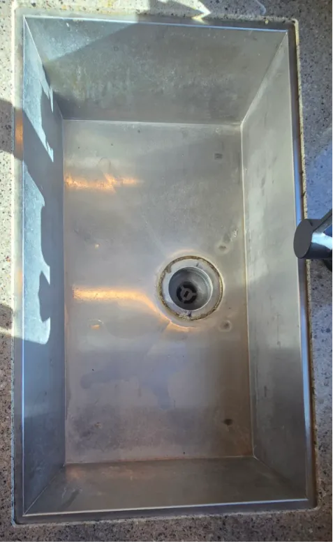 RV kitchen sink before professional interior cleaning