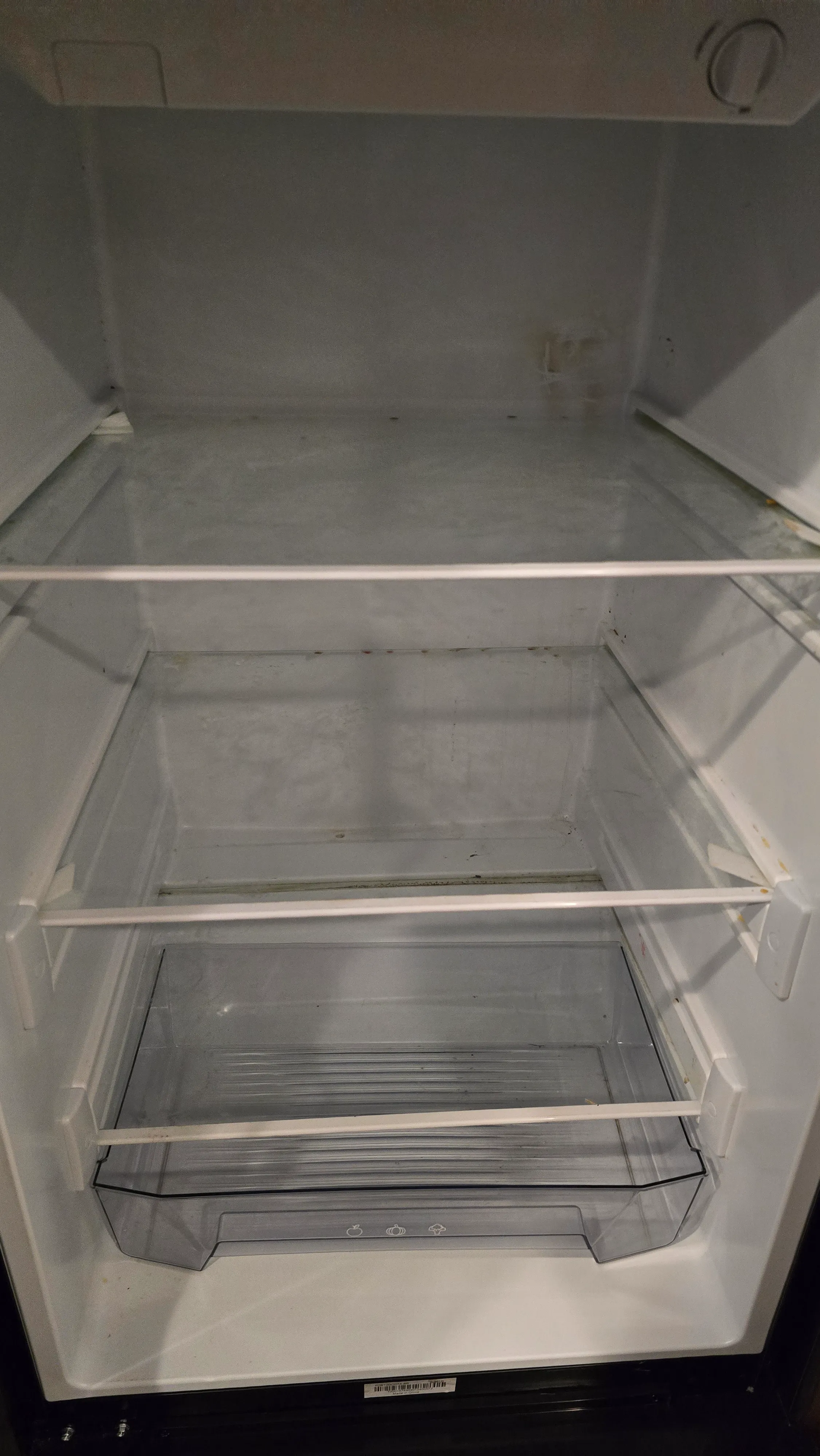 RV refrigerator before interior cleaning